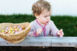 © Melissa Milis Photography/Stocksy - little girl in pajamas searching for eggs on easter day