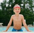 © Jakob Lagerstedt/Stocksy - Cute young boy by the pool