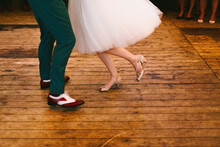 Close Up Of Rock And Roll Couple Dancing On A Wooden Floor