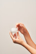 © 365mm/Stocksy - Anonymous female taking cream from jar