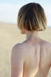 © Amsterdam/Stocksy - back of woman with short hair