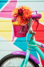 Bouquet Of Bright Flowers In Bike Basket