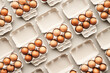© 365mm/Stocksy - Carton boxes with eggs in rows