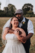 © Leah Flores/Stocksy - Bride and Groom in Intimate Hug on Wedding Day at Sunset