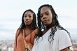 © Jimena Roquero/Stocksy - Two black attractive young women looking at camera
