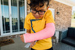 © Jessica Klaus/Stocksy - Boy showing off broken arm.