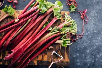 Chopped fresh rhubarb on Blue background. Top view. Free copy space