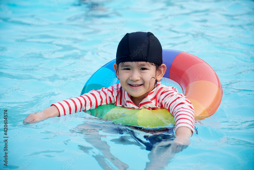 Cute Asian girl playing with water in hot spring swimming pool Stock ...