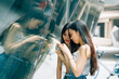 © Pansfun Images/Stocksy - Young Asian women traveling in the city take pictures with camer