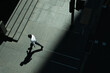 © Hugo Lima/Stocksy - Man walking in pavement