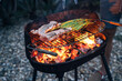 © David Prado/Stocksy - Salmon Meat with asparagus on outdoor grill