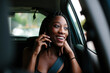 © Jimena Roquero/Stocksy - Young attractive woman inside a car talking on the phone