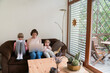 © Hernandez & Sorokina/Stocksy - Mother With Two Daughters At Home