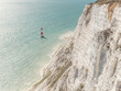 © Andrew Urwin/Stocksy - Lighthouse at sea
