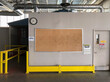 © Raymond Forbes Photography/Stocksy - Bulletin Board on Factory Floor