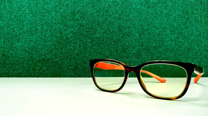 Glasses with green canvas background. Suitable for presentation slide title