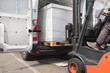 © Jelena Jojic Tomic/Stocksy - The worker transports freight into a van using a forklift