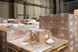 © Jelena Jojic Tomic/Stocksy - A small warehouse packed with a carload ready for distribution
