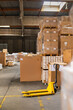 © Jelena Jojic Tomic/Stocksy - A small warehouse packed with a carload ready for distribution
