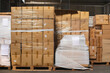 © Jelena Jojic Tomic/Stocksy - A small warehouse packed with a carload ready for distribution
