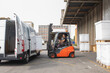 © Jelena Jojic Tomic/Stocksy - The worker transports freight into a van using a forklift