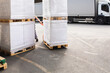 © Jelena Jojic Tomic/Stocksy - One man operates the pallet jack in a warehouse full of shipping goods