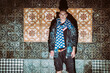 © Igor Madjinca/Stocksy - fashion in front of an old tiled wall