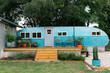 © Kristen Curette Photography LLC/Stocksy - Cute retro blue RV / travel trailer