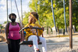 © Luis Velasco/Stocksy - Mom And Little Black Girl In The Park.