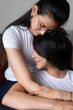 © Felix Chacon/Stocksy - Lesbian couple lgtb hugging at home