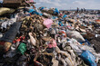 © Hakan & Sophie/Stocksy - plastic pollution in landfill