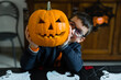 © Giorgio Magini/Stocksy - Cute kid with creative pumpkin on Halloween