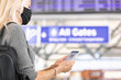 © Sean Locke Photography/Stocksy - Travel: Woman Checks E-Ticket On Cell Phone