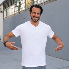 Wall Mural - Man wearing casual white t-shirt in the city apparel shoot