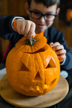 Delighted Child With Jack O Lantern On Halloween