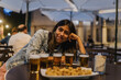 © Tadeu Dreyer/Stocksy - Young woman smiling with five beers