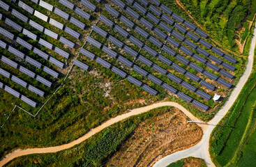 Wall Mural - Solar photovoltaic base built by aerial photography mountain