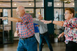 © VISUALSPECTRUM/Stocksy - Senior Citizens Exercising Indoors