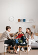 © Alina Hvostikova/Stocksy - Female realtor and couple in new apartment