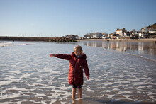 Excited Child Points Out To Sea.