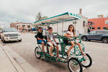 Family Riding Around St. Joe Michigan In A Surrey Bike.