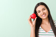 © Pixel-Shot - Beautiful young woman with red heart on color background