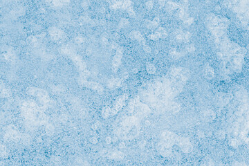 Wall Mural - Blue tone, textured ice surface with air bubbles inside.