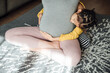© MaaHoo Studio/Stocksy - Pregnant woman and daughter at home