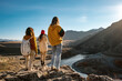 © cppzone - Three female hikers or tourists in sunset mountains