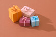 © Maki Company Limited/Stocksy - Handcraft gift box and christmas tree isolated on color background