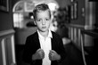 © Jakob Lagerstedt/Stocksy - Handsome young boy wearing a blazer