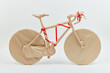 © Yaroslav Danylchenko/Stocksy - Creative gift on birthday bike wrapped of craft paper.