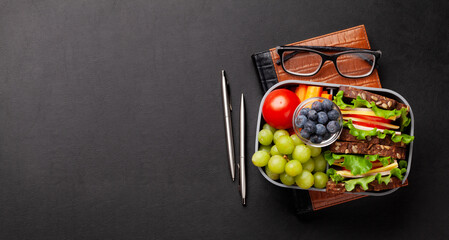 Wall Mural - Healthy office lunch box with sandwich and fresh vegetables