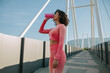 © AD Photography/Stocksy - Woman exercising outside